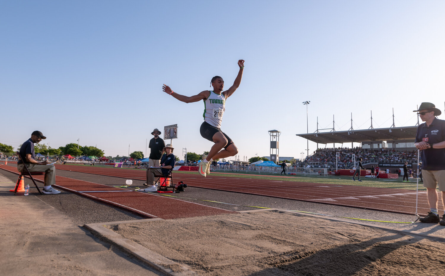Tumwater’s Makhi Odoms leaps during the finals of the boys long jump at the WIAA 2A/3A/4A State Track and Field Championships on Thursday, May 25, 2023, at Mount Tahoma High School in Tacoma. (Joshua Hart/For The Chronicle)